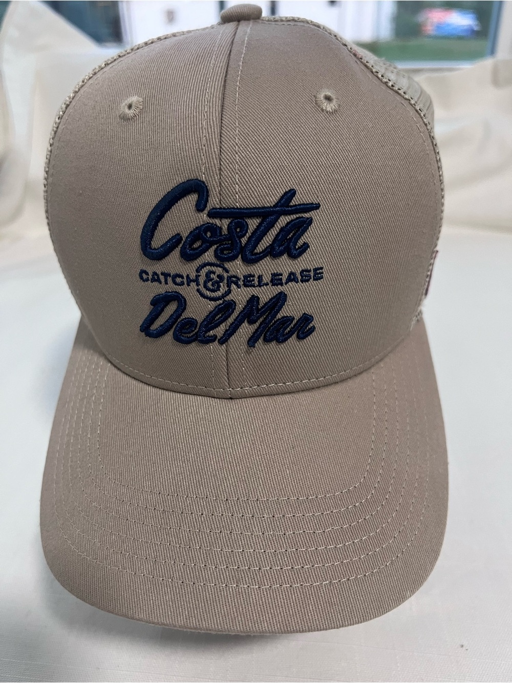Costa Tan Trucker Hat with Navy Embroidery